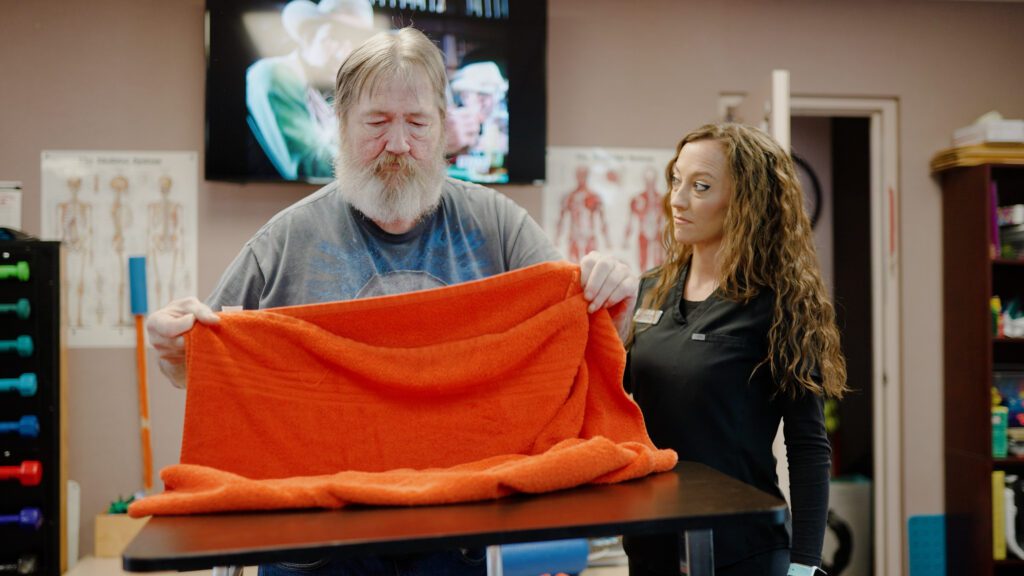 A man in physical therapy at a short term care facility